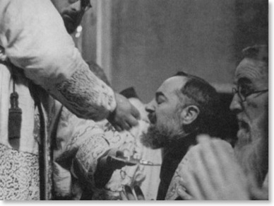 Padre Pio Receiving Communion