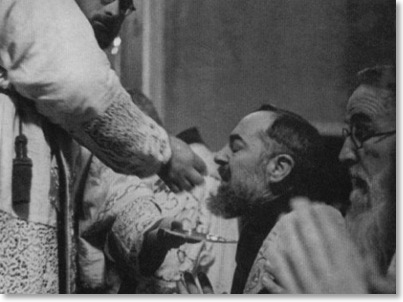 Padre Pio Receiving Communion